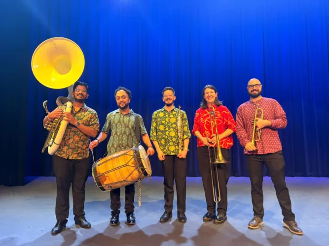 Butter Chicken Brass Band performs for students